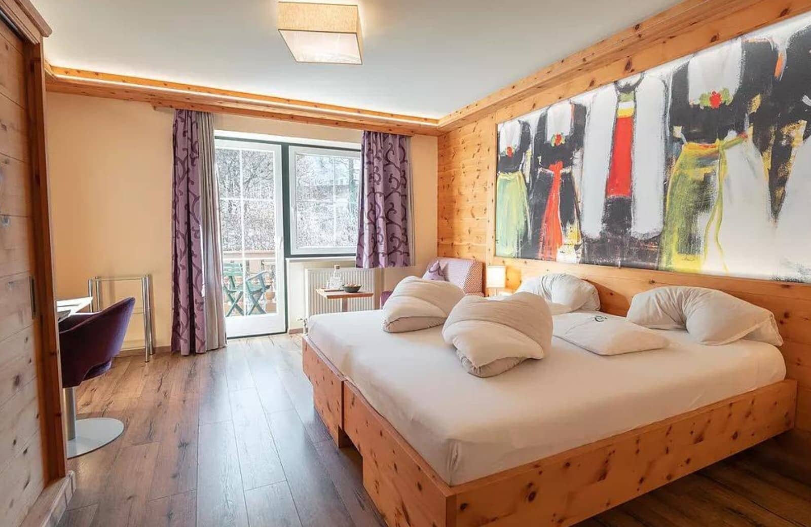 Guest bedroom with king bed and private balcony access