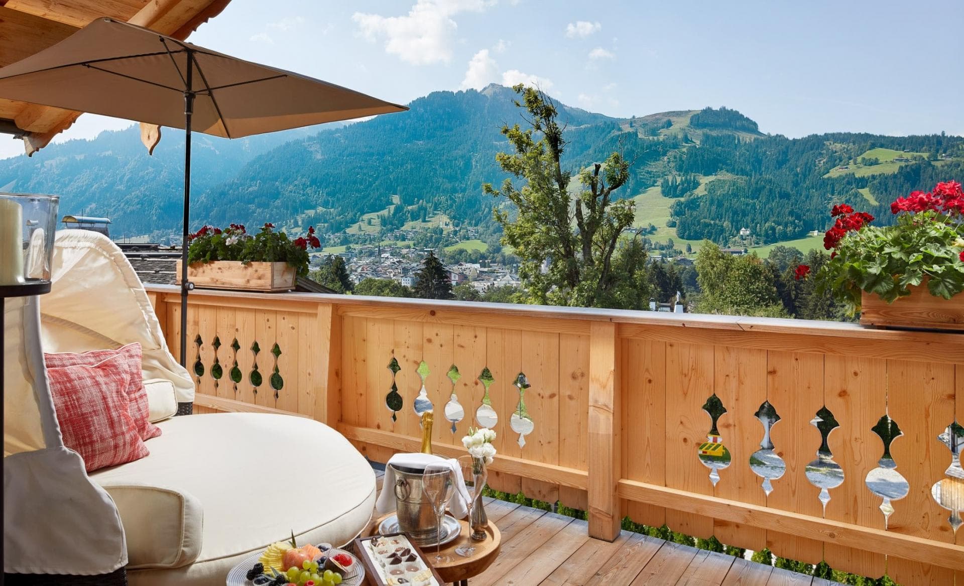 Private balcony with circular daybed and mountain views
