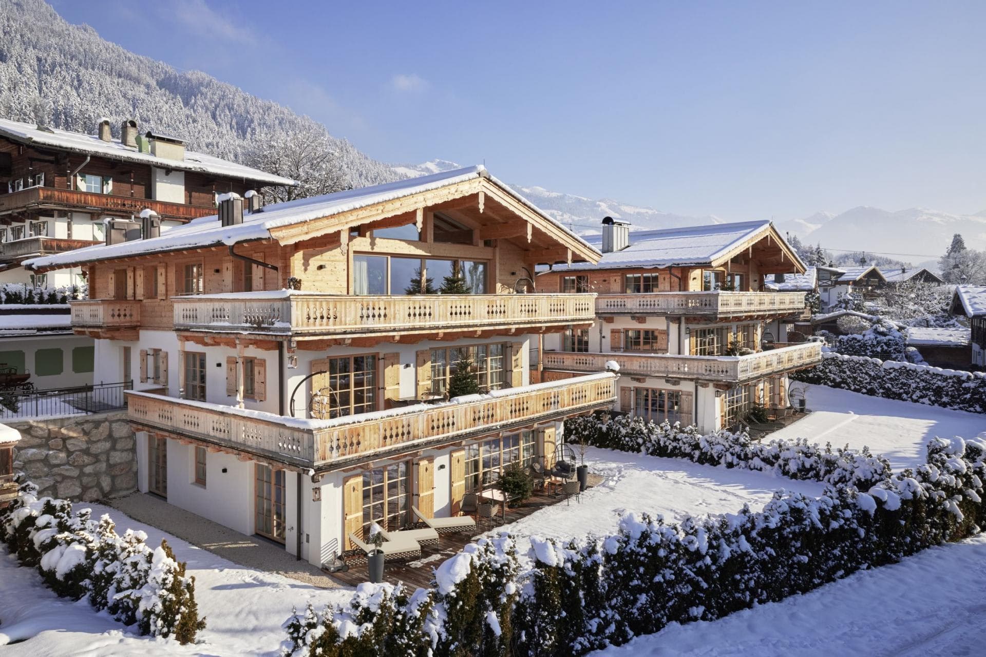 Chalet exterior with wrap-around balconies and mountain views