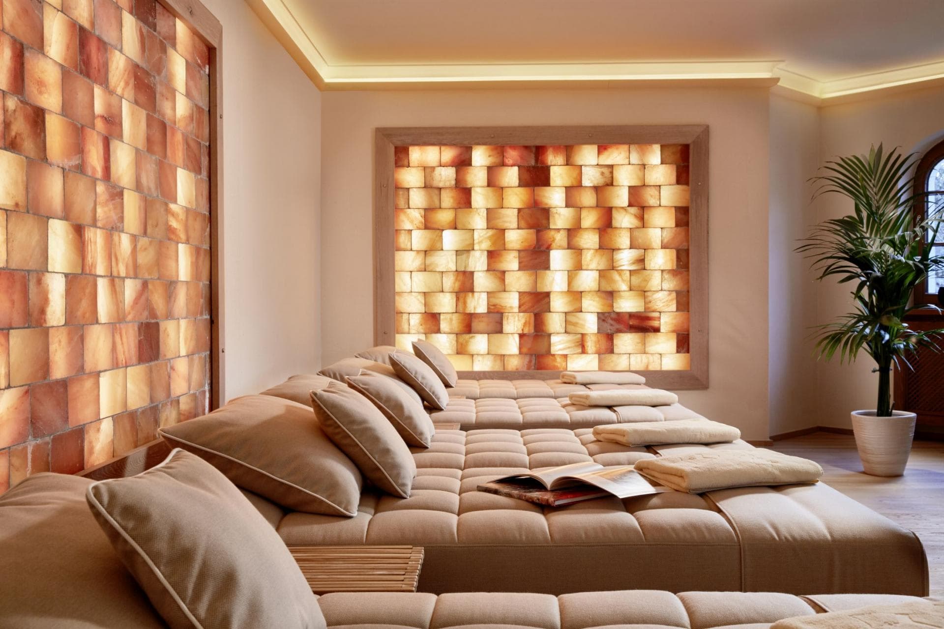 Salt stone relaxation room with four cushioned loungers