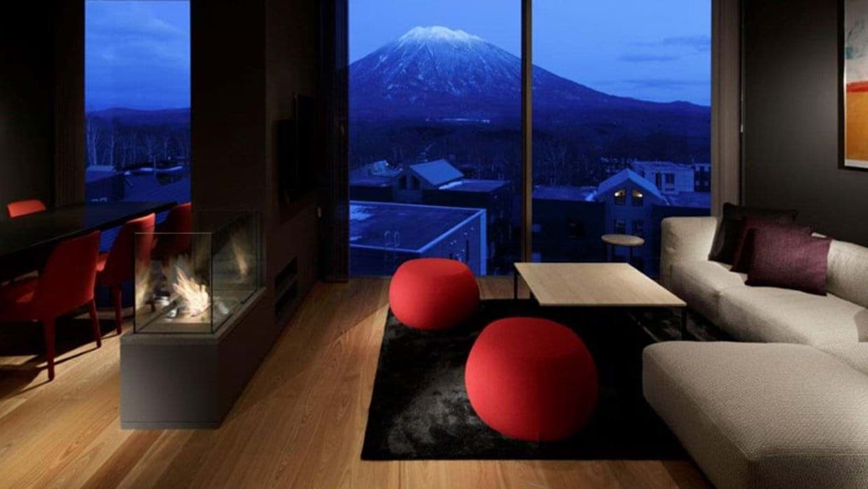 Living area with gas fireplace and direct views of Mount Yotei