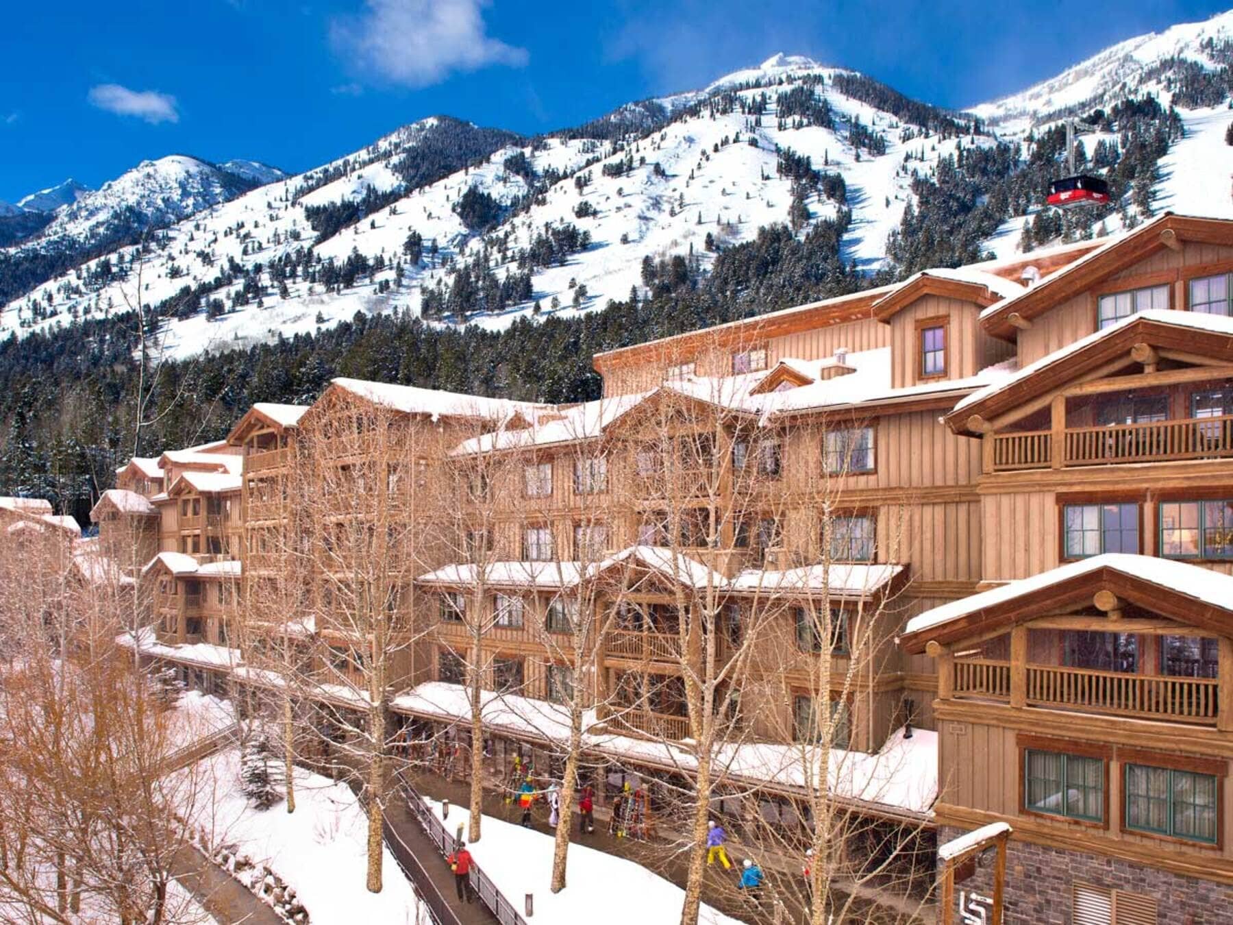 Ski-in/ski-out lodge exterior with direct access to gondola and mountain trails