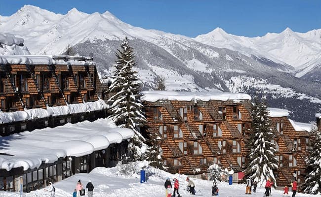 Ski-in/ski-out chalet exterior with direct access to alpine slopes