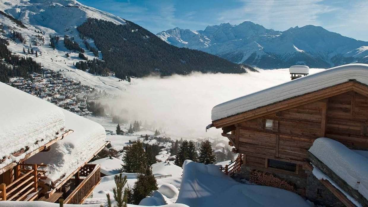 Chalet balcony view of Verbier village and the Swiss Alps