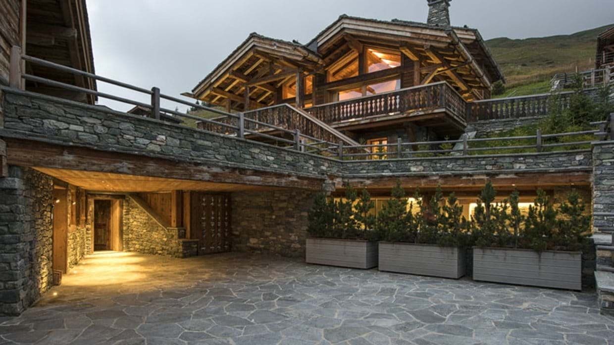 Stone-paved courtyard with heated underground parking and multi-level terrace access