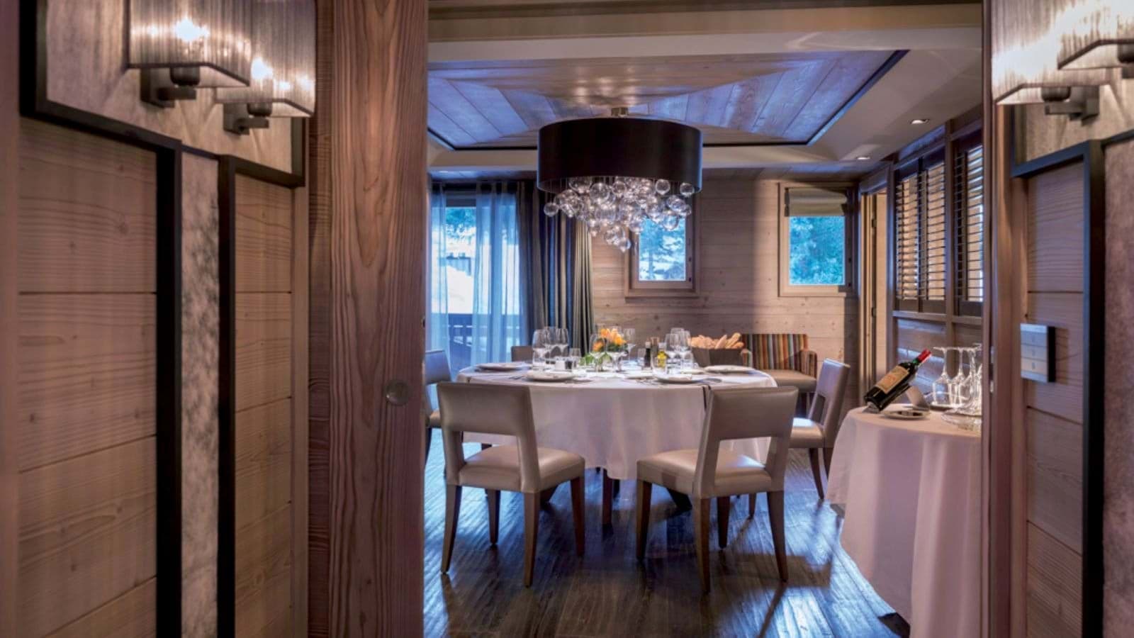 Formal dining room with seating for 8 and reclaimed wood paneling