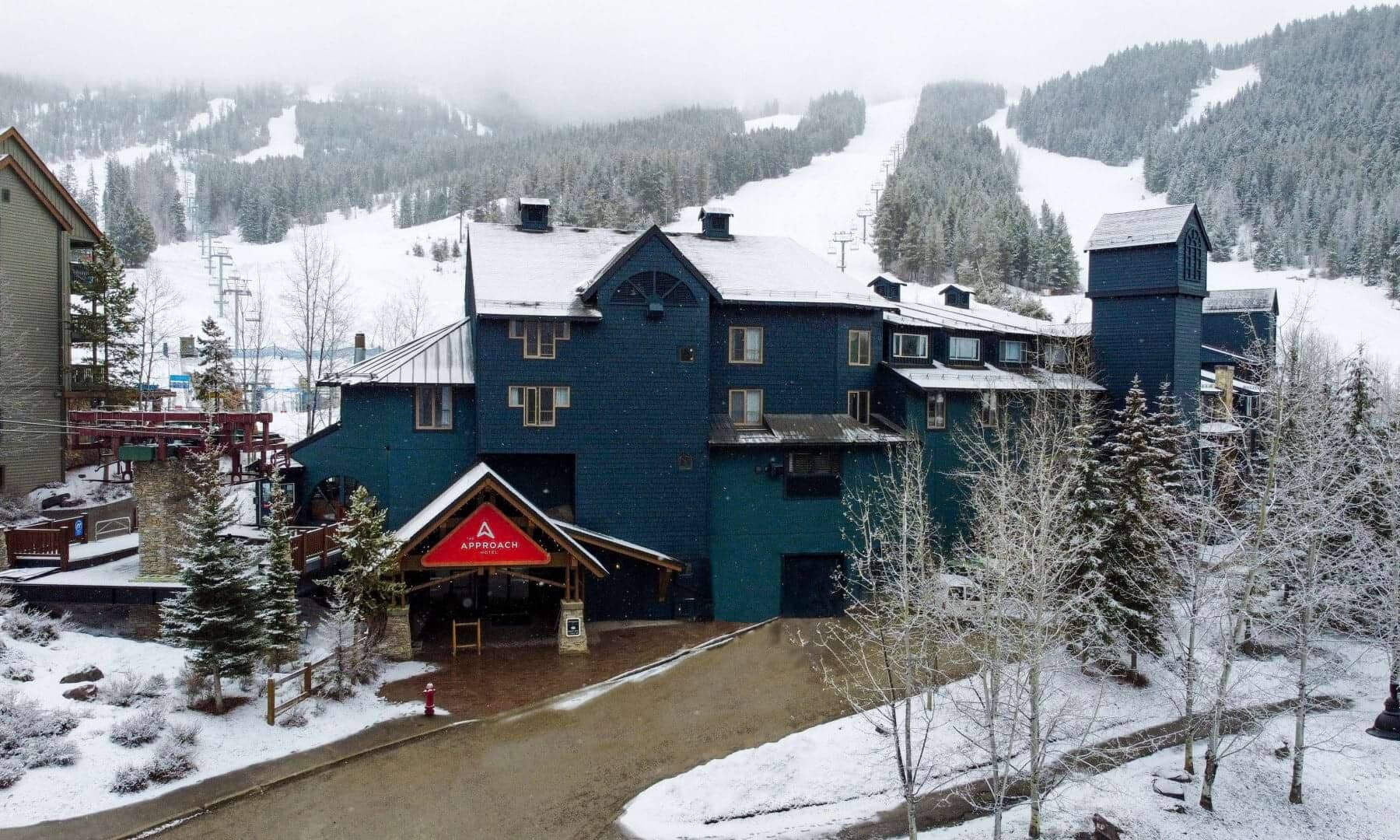 Slopeside building exterior with direct ski-in access and mountain views
