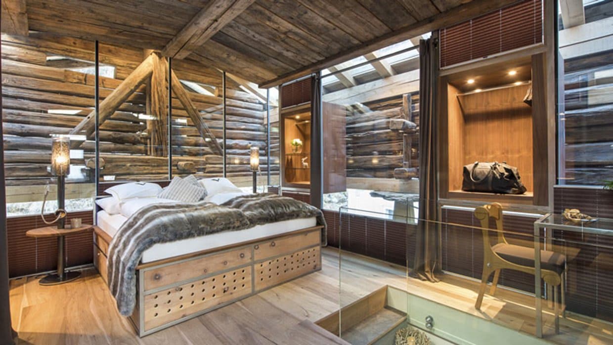 Loft bedroom with queen bed, under-bed storage, and built-in closet nooks