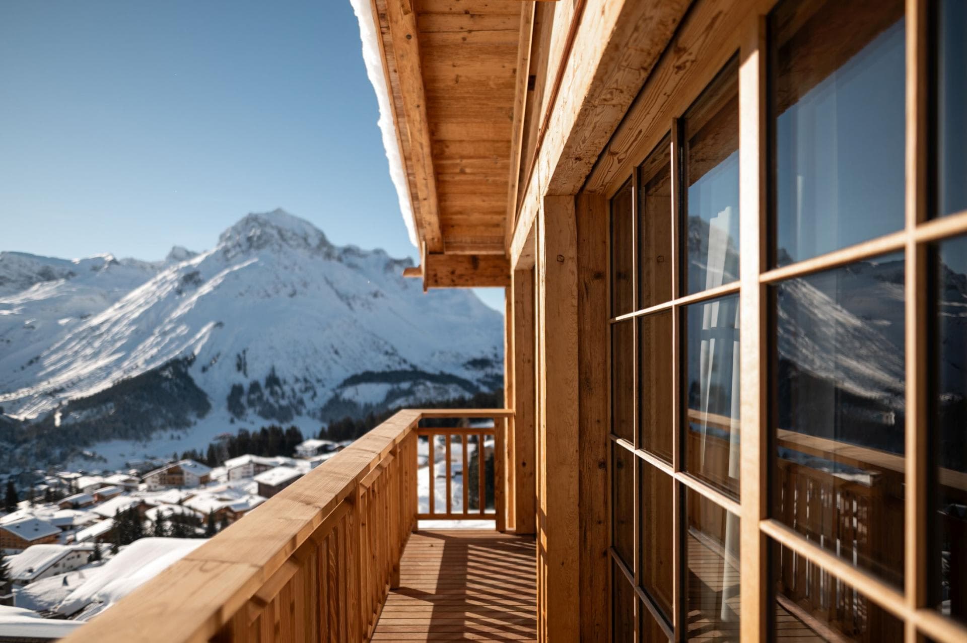 Private timber balcony with panoramic mountain and village views