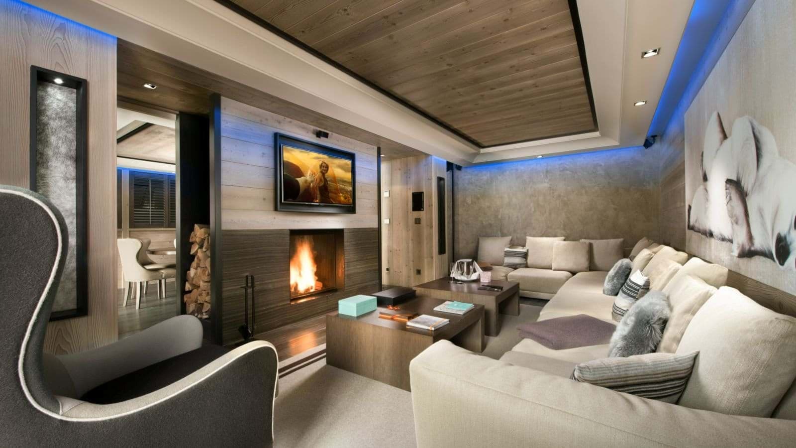 Media room with wood-burning fireplace and sectional seating for 8