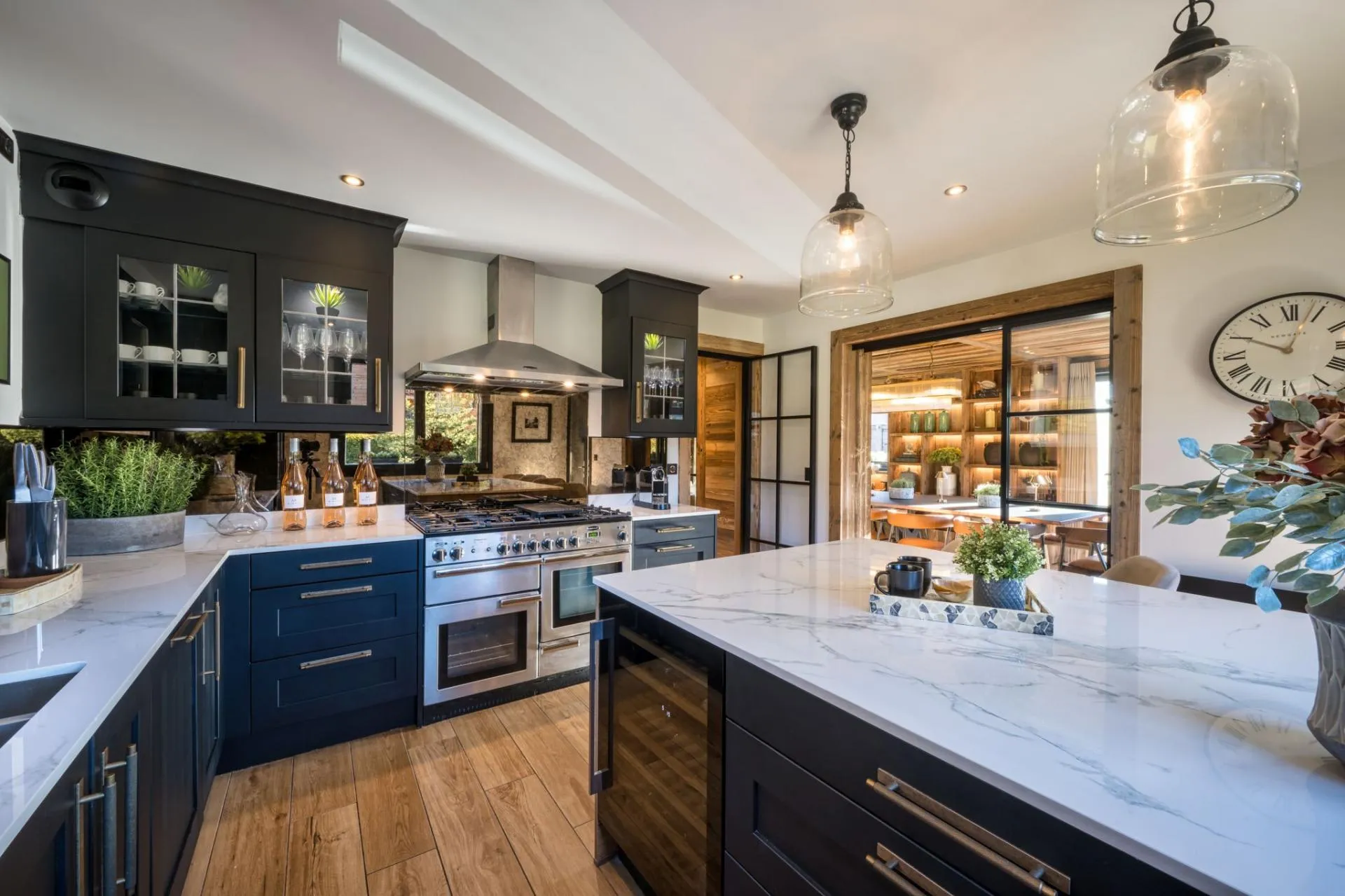 Kitchen with double ovens, range and integrated wine fridge