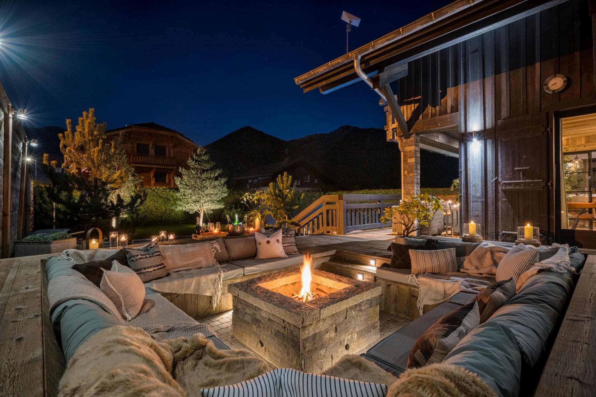 Sunken outdoor fire pit with built-in lounge seating for 12