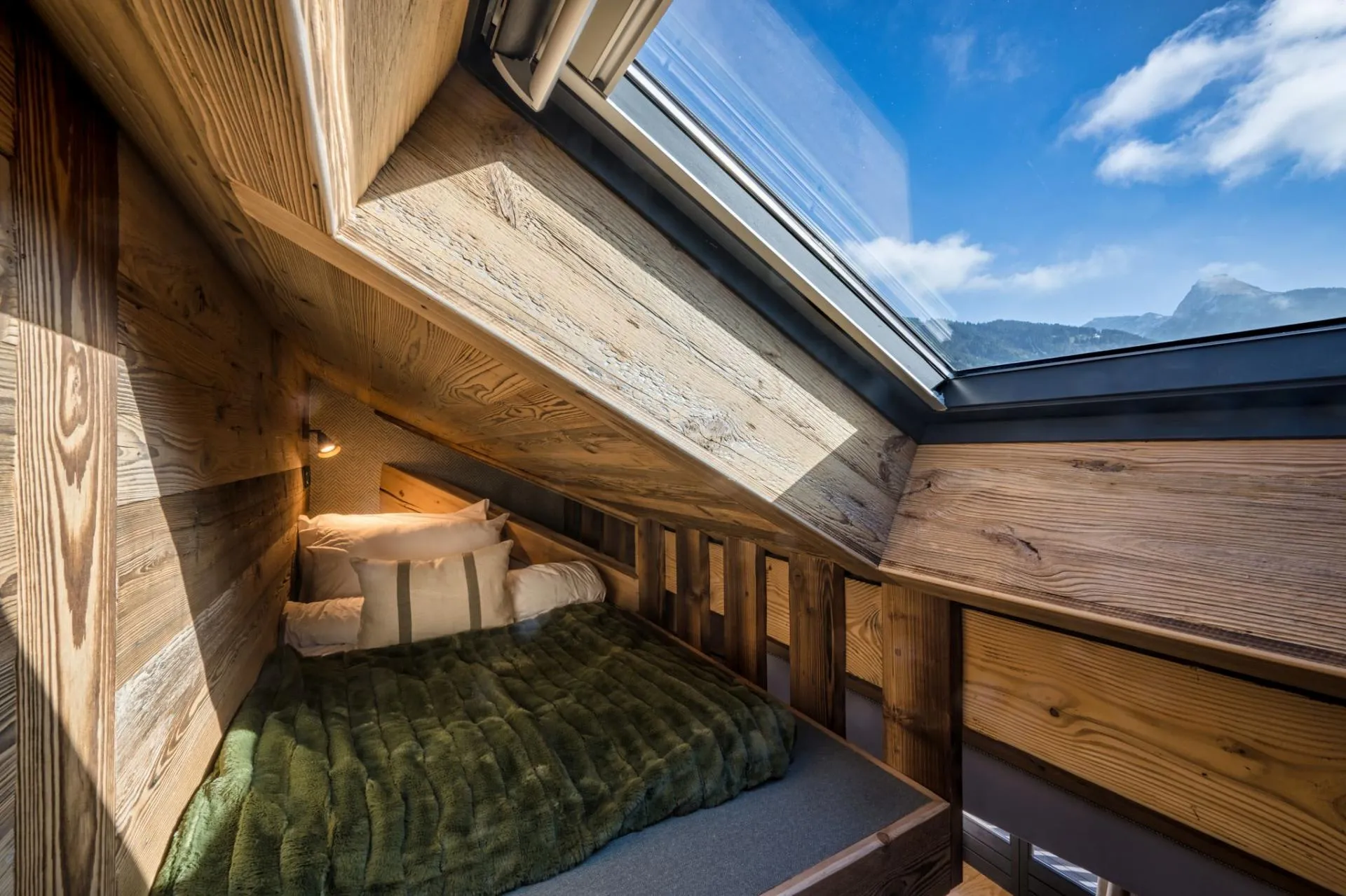 Two raised bunk beds above the main bedroom