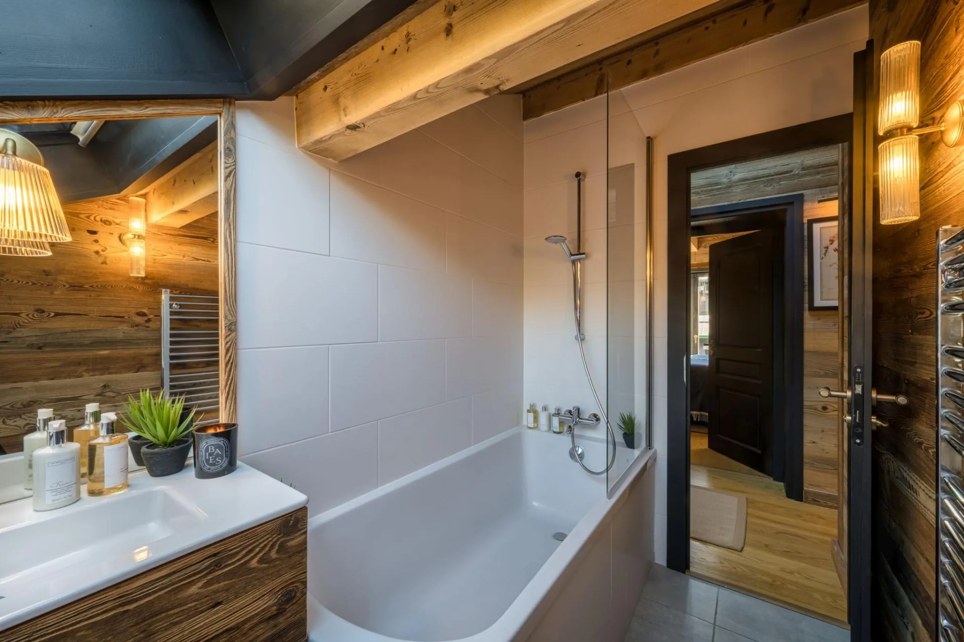 Bathroom with a bathtub, separate shower and heated towel rail