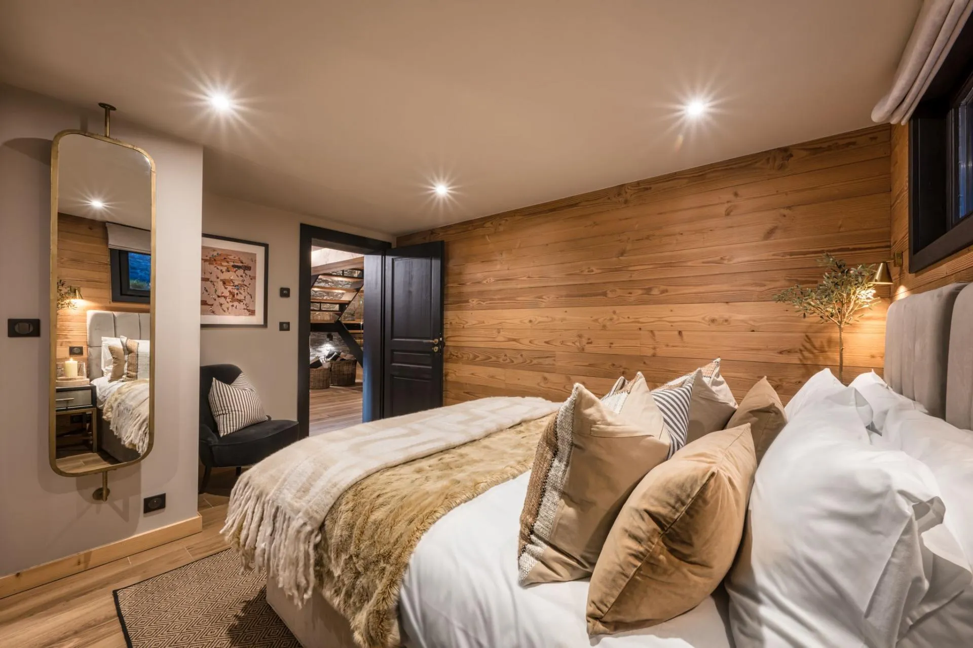 King-or-twin bedroom with a reclaimed timber wall and full-height mirror