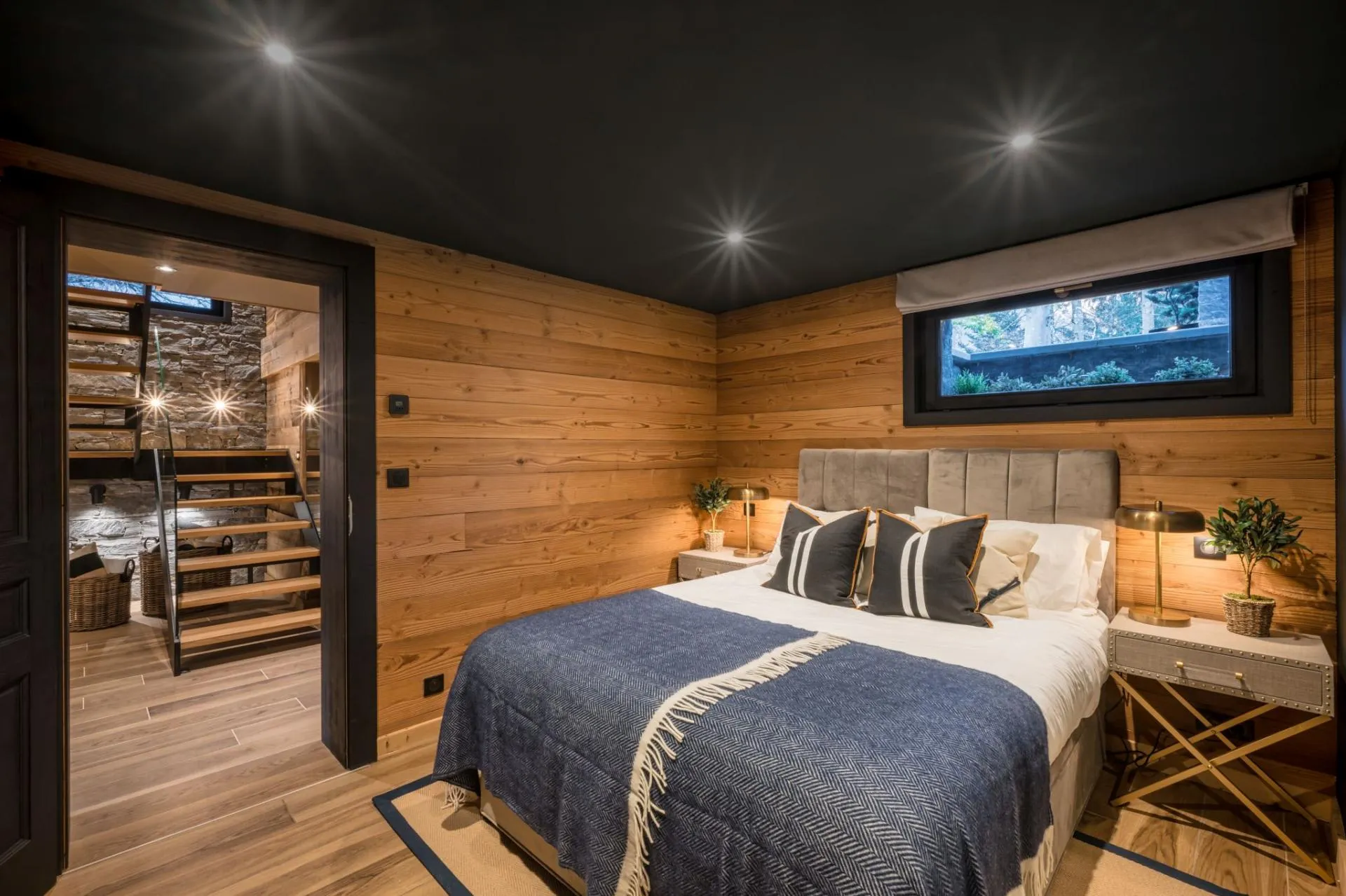 Lower-level king-or-twin bedroom beside the staircase