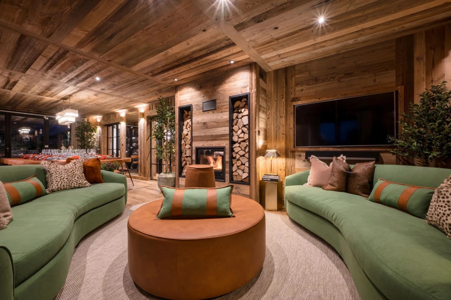 Living area with a feature fireplace and curved seating