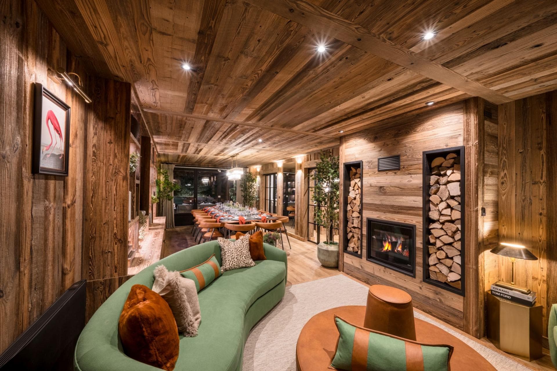 Open living area with wood-burning fireplace and dining table for 12