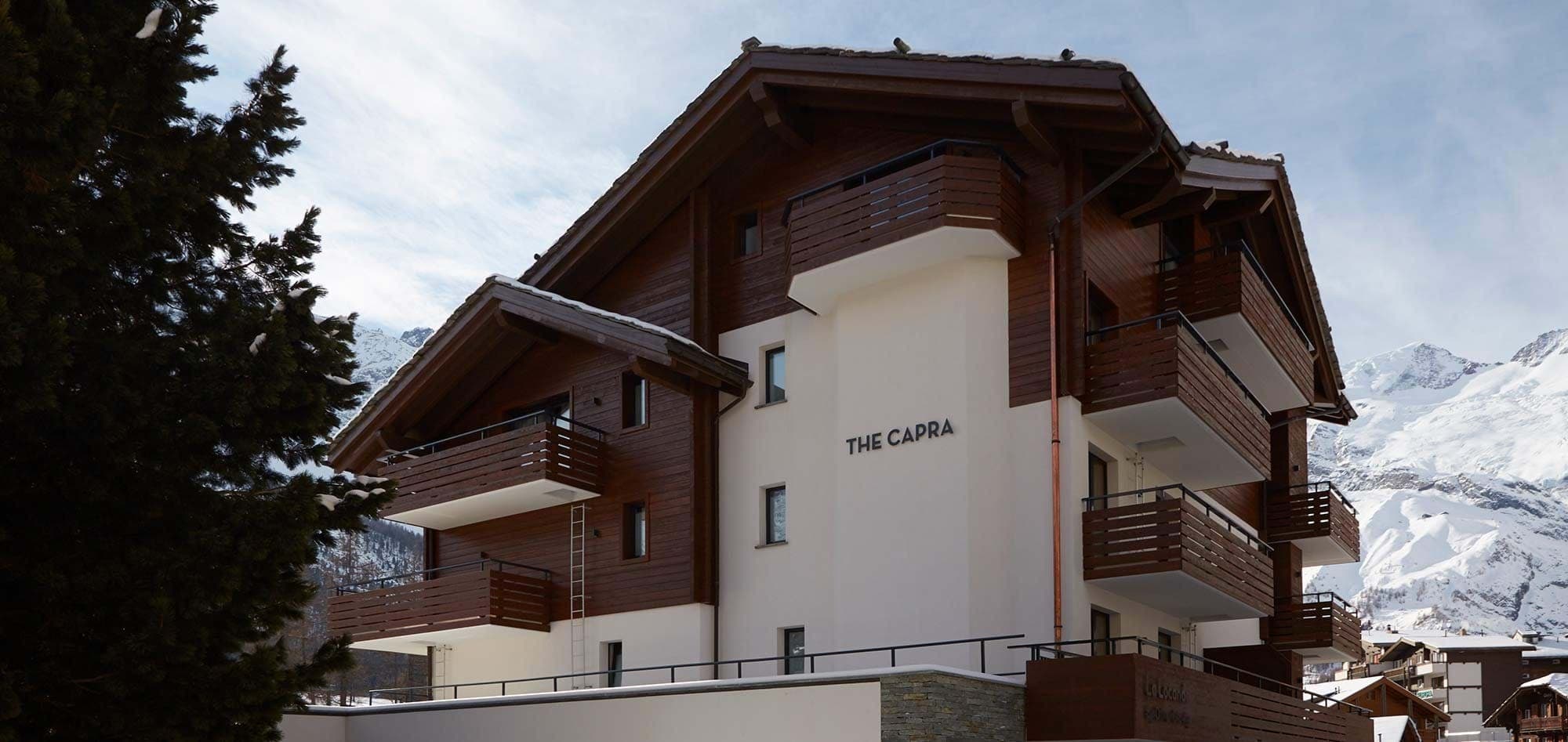 Chalet exterior with private balconies and mountain views