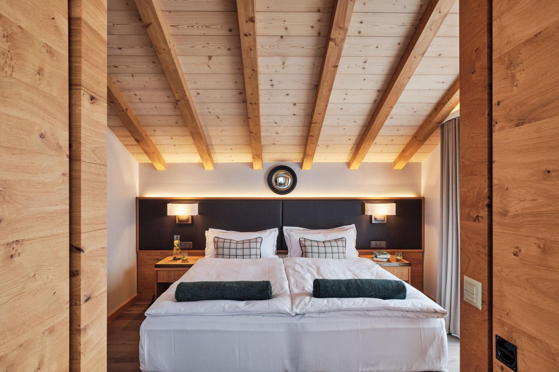 Bedroom with king bed and vaulted wood-beam ceilings