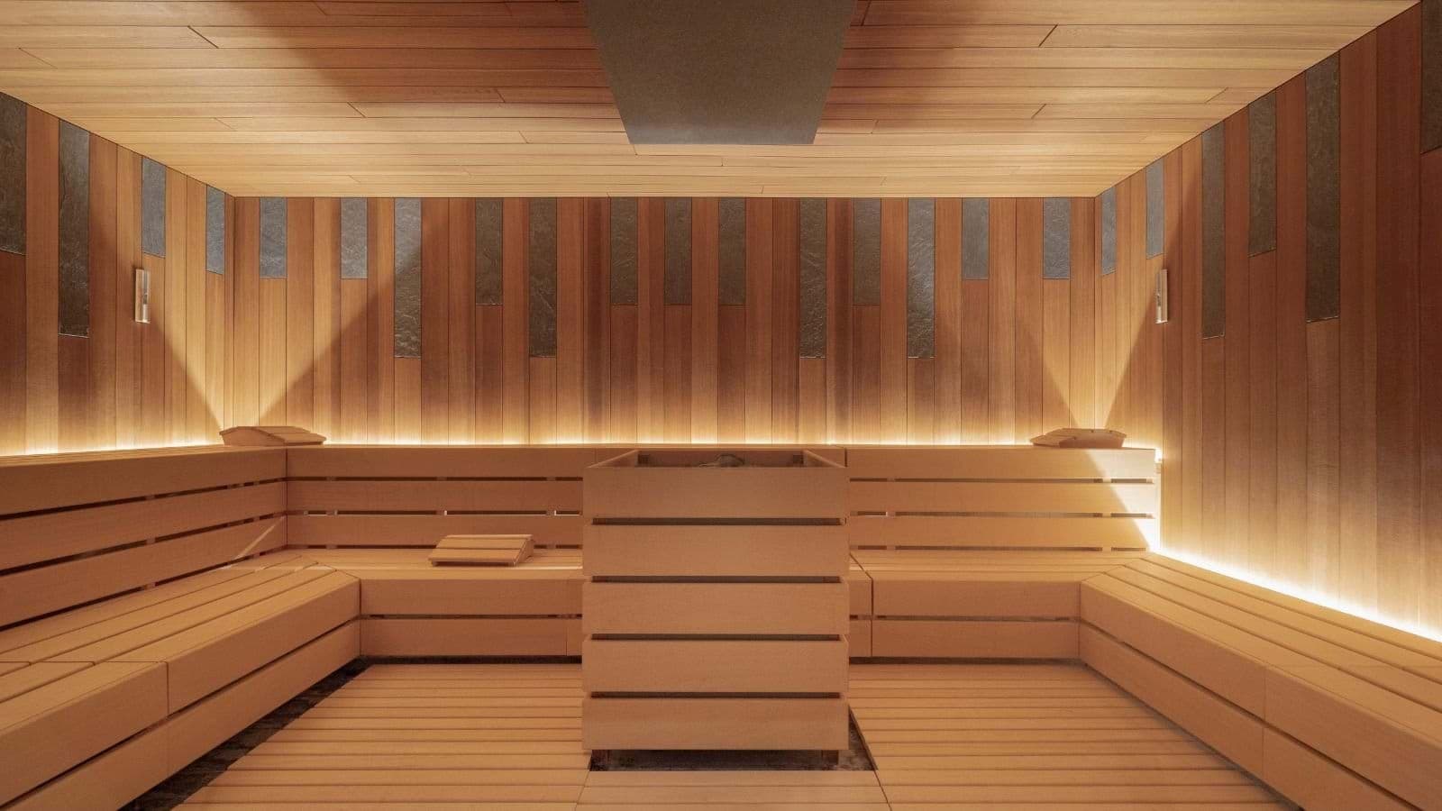 Cedar sauna with tiered bench seating and integrated backrest lighting