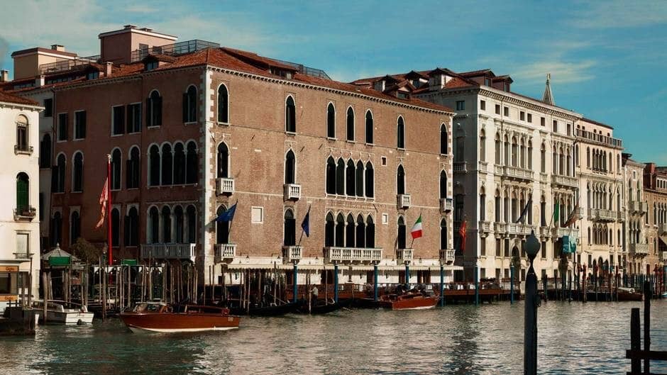 Venetian palazzo exterior with private water dock and Gothic windows