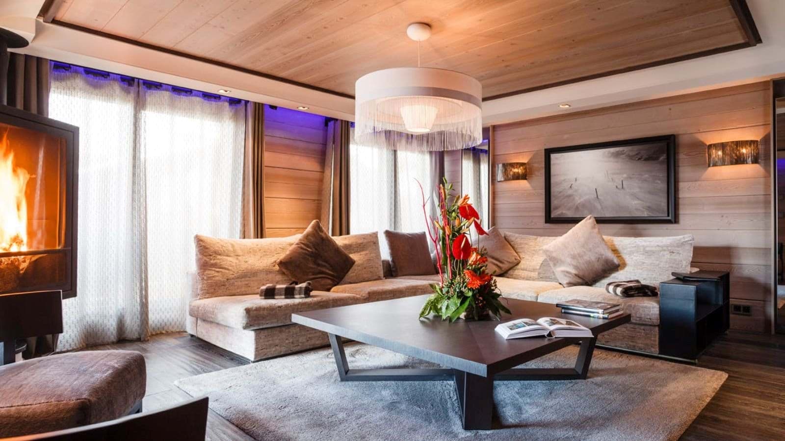 Living area with wood-burning fireplace and large sectional seating