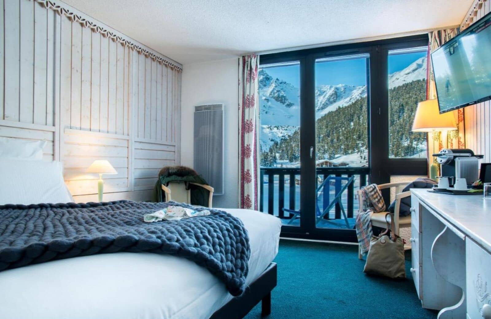 Bedroom with mountain views, private balcony, and Nespresso station