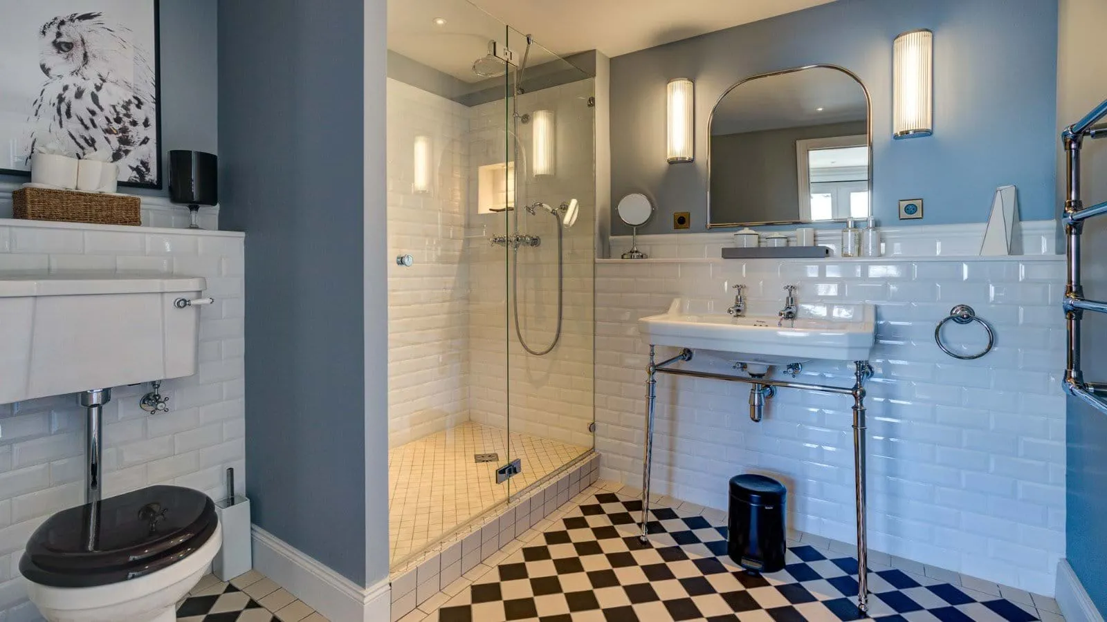 Bathroom with walk-in glass shower and heated towel rail