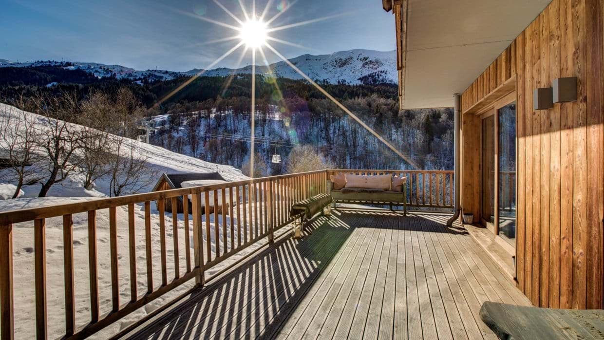 Wooden deck with mountain views and nearby ski lift