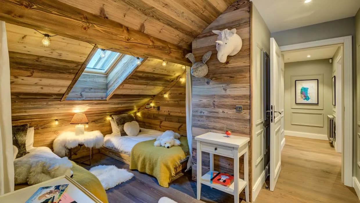 Attic bedroom with two twin beds and overhead skylight