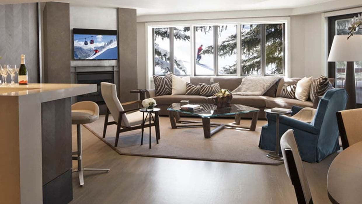 Living room with gas fireplace and direct views of the ski slopes