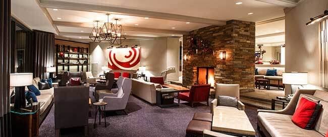 Shared lounge area with wood-burning fireplace and multi-zone seating