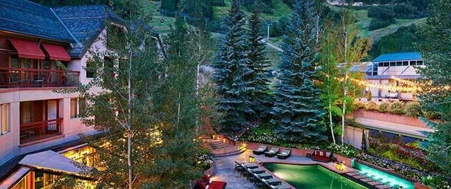 Shared heated pool and patio with mountain views and ski-in access