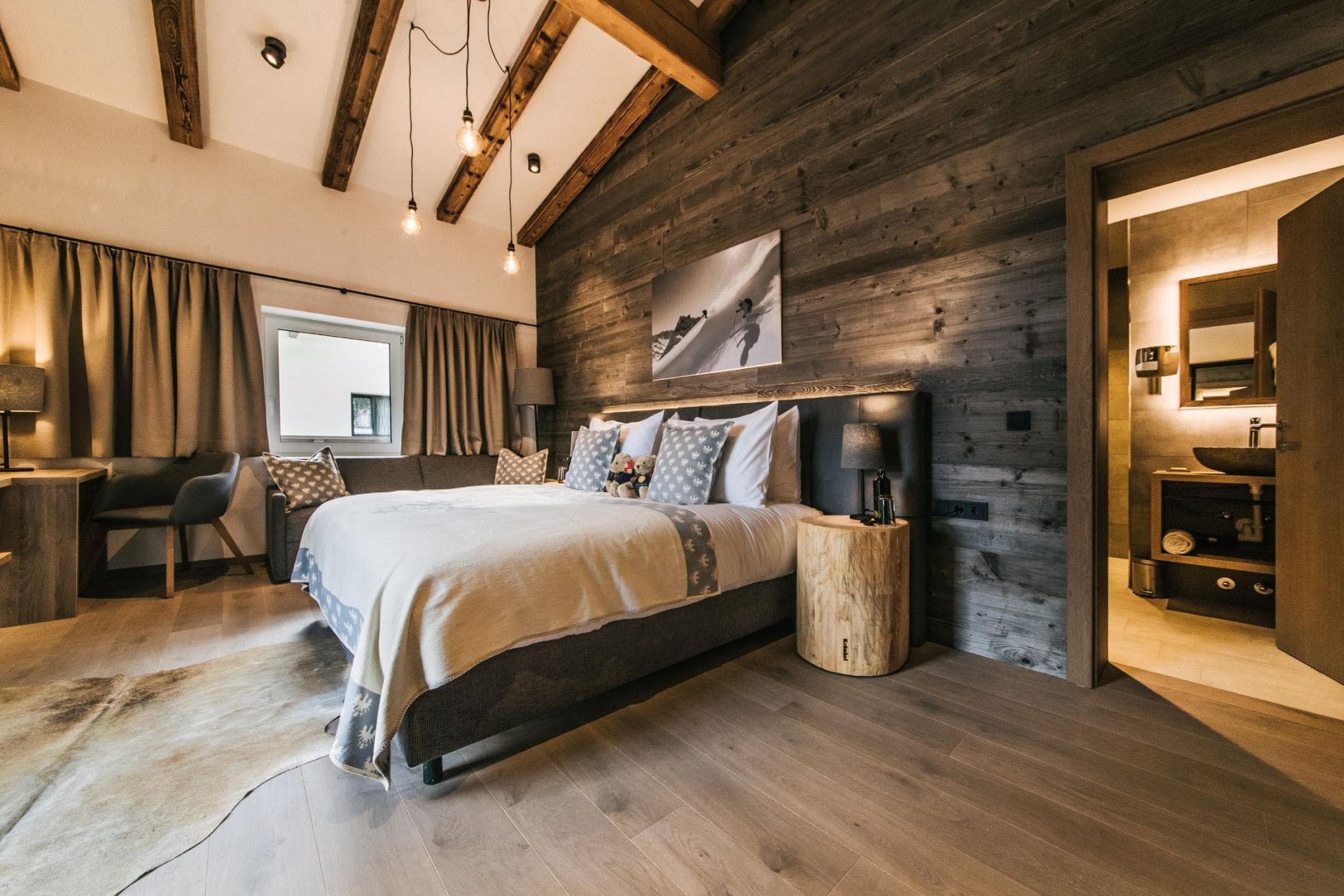 Bedroom with king bed, desk nook, and ensuite bathroom access