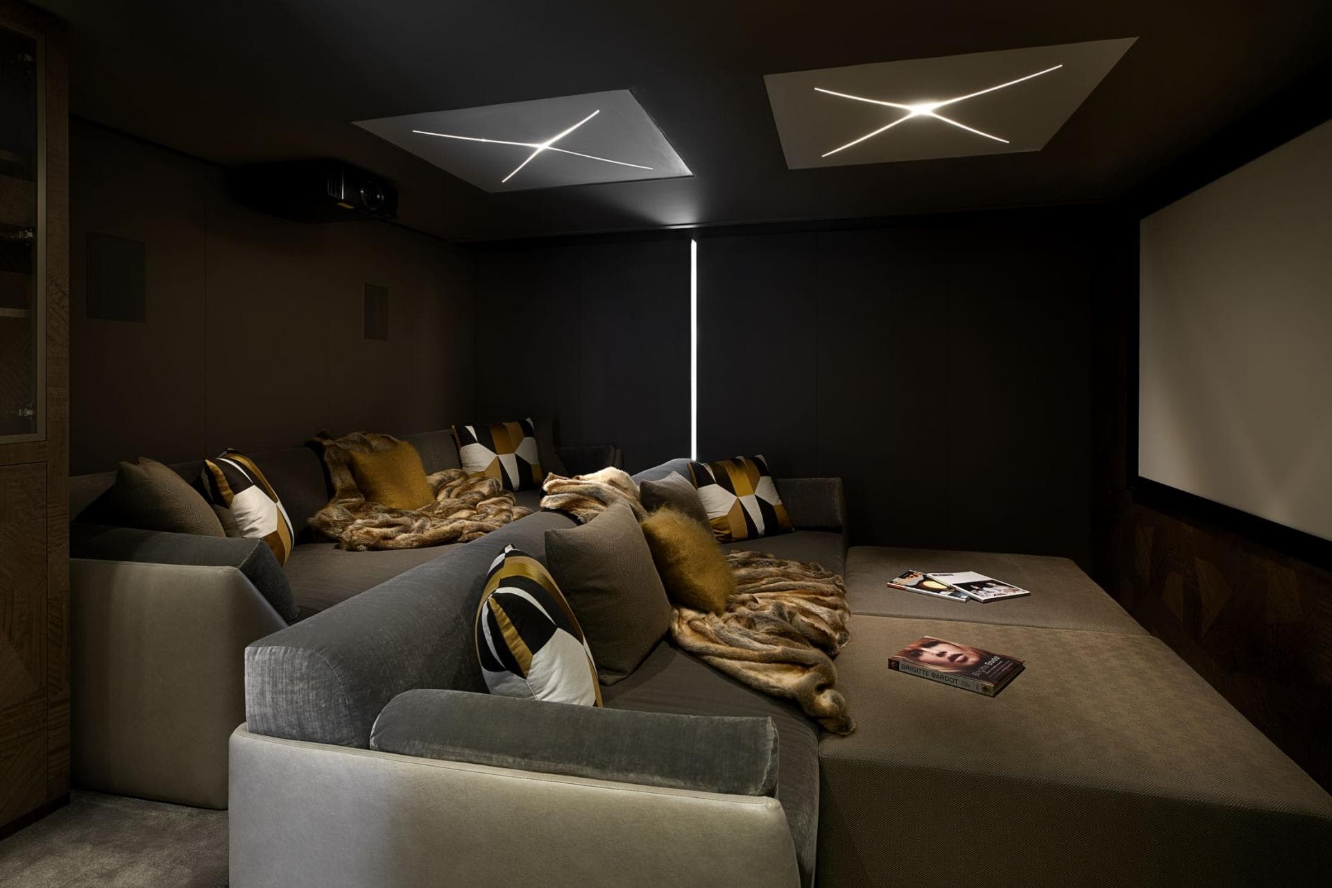 Private cinema with projector and tiered daybed seating