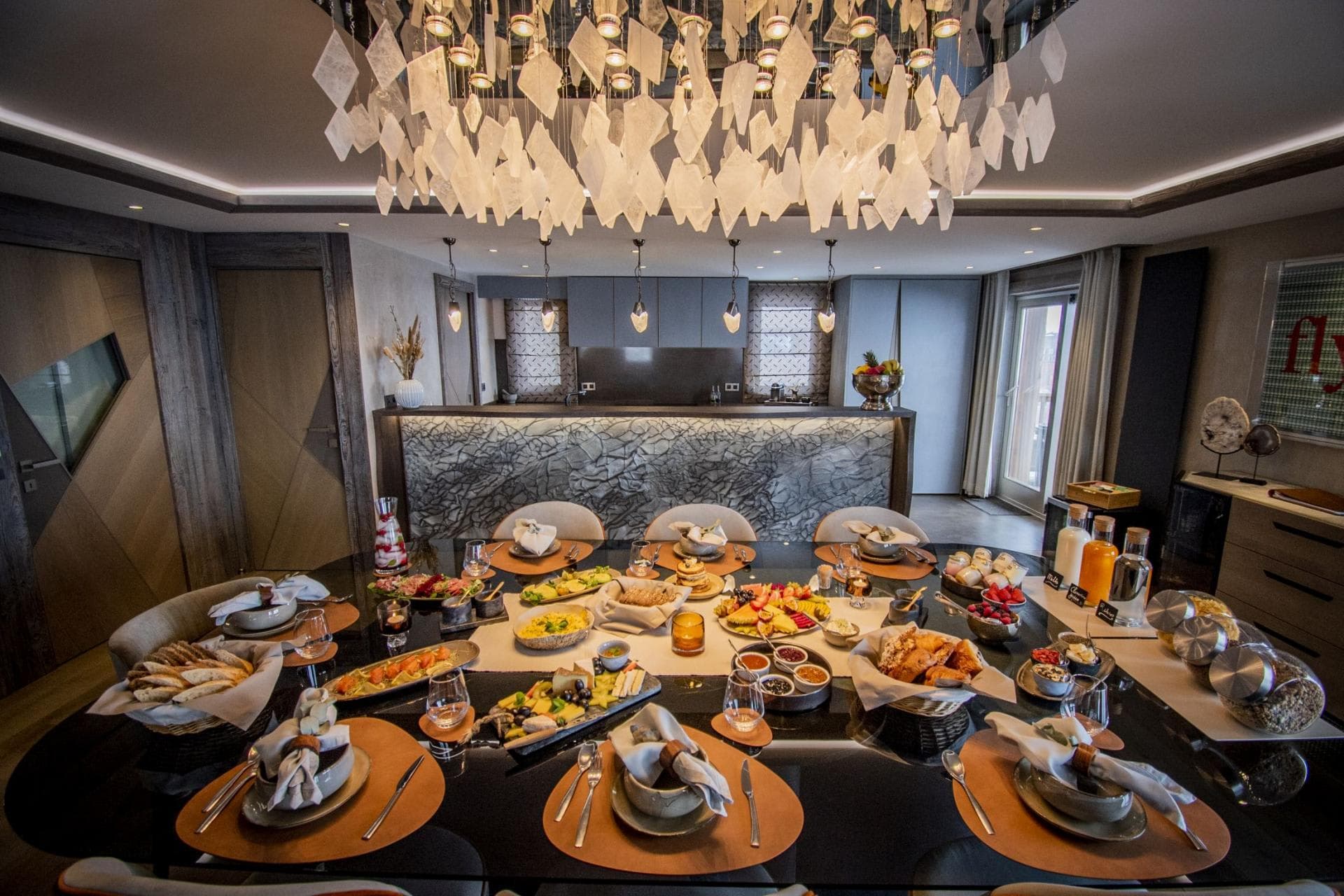 Dining area with seating for 10; adjacent kitchen and breakfast bar