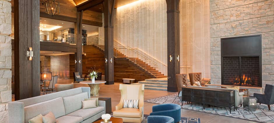 Lobby lounge with wood-burning fireplace and multiple conversational seating areas