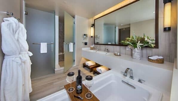 Bathroom with deep soaking tub and separate frosted glass shower