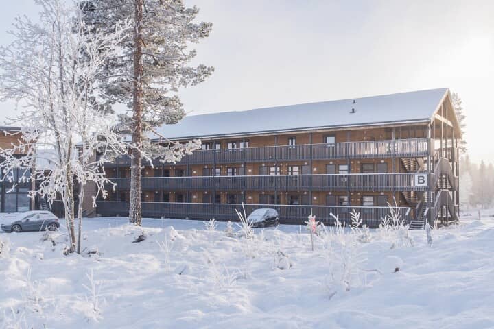 Timber-clad exterior with private balconies and on-site parking