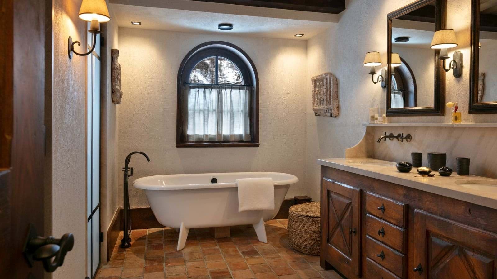 Bathroom with clawfoot soaking tub and dual vanity