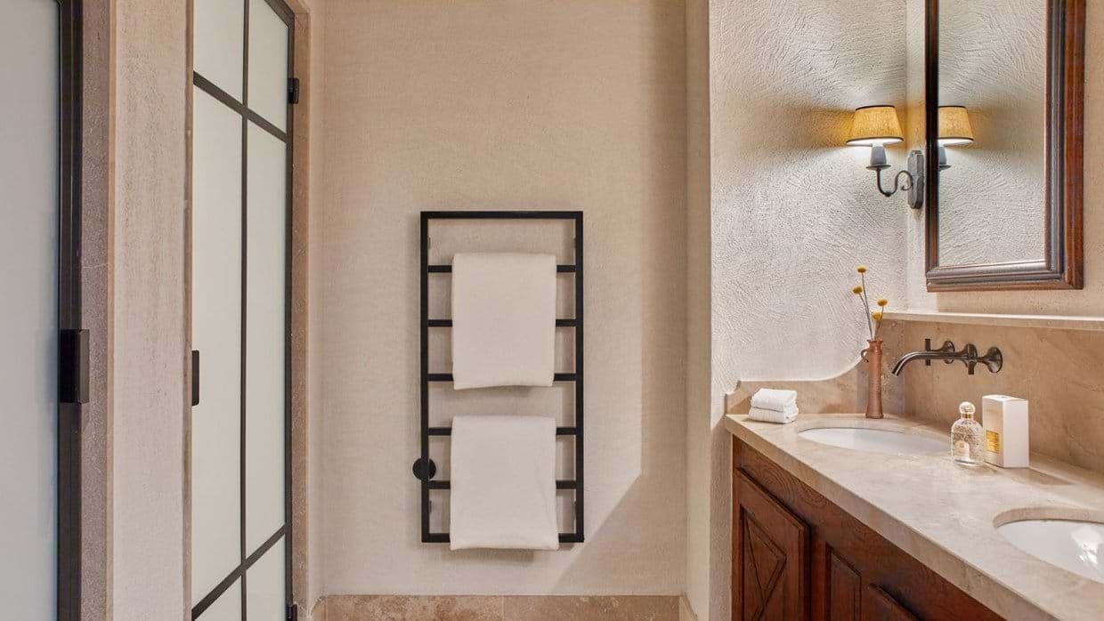 Bathroom with dual vanity and heated towel rack