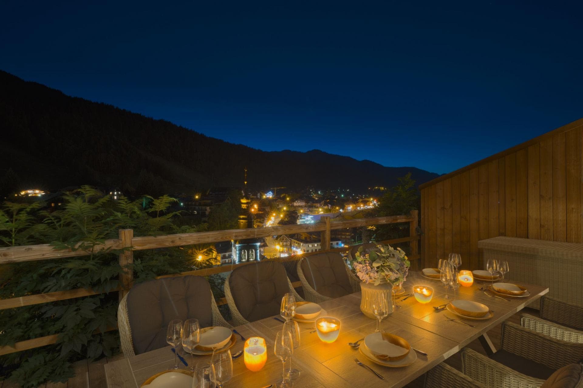 Private terrace dining table for 8 with illuminated village views