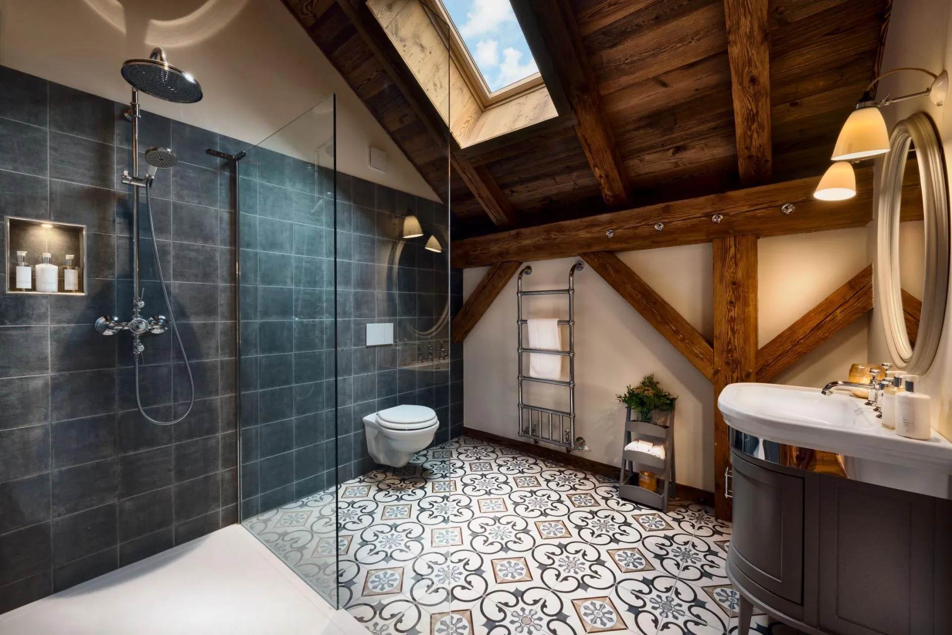 En-suite bathroom with a walk-in shower, patterned floor tiles and timber beams
