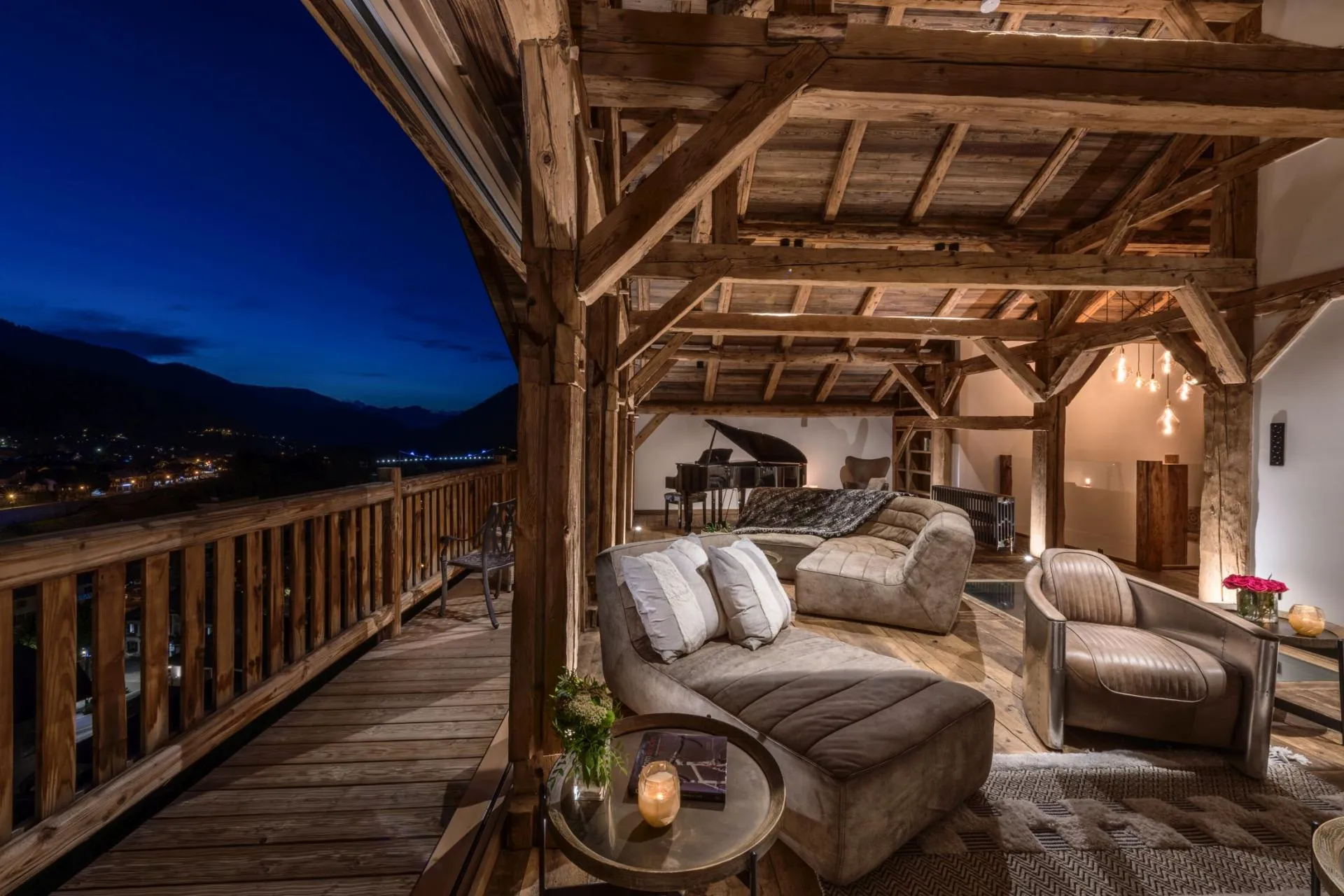 Covered timber terrace with lounge seating and baby grand piano