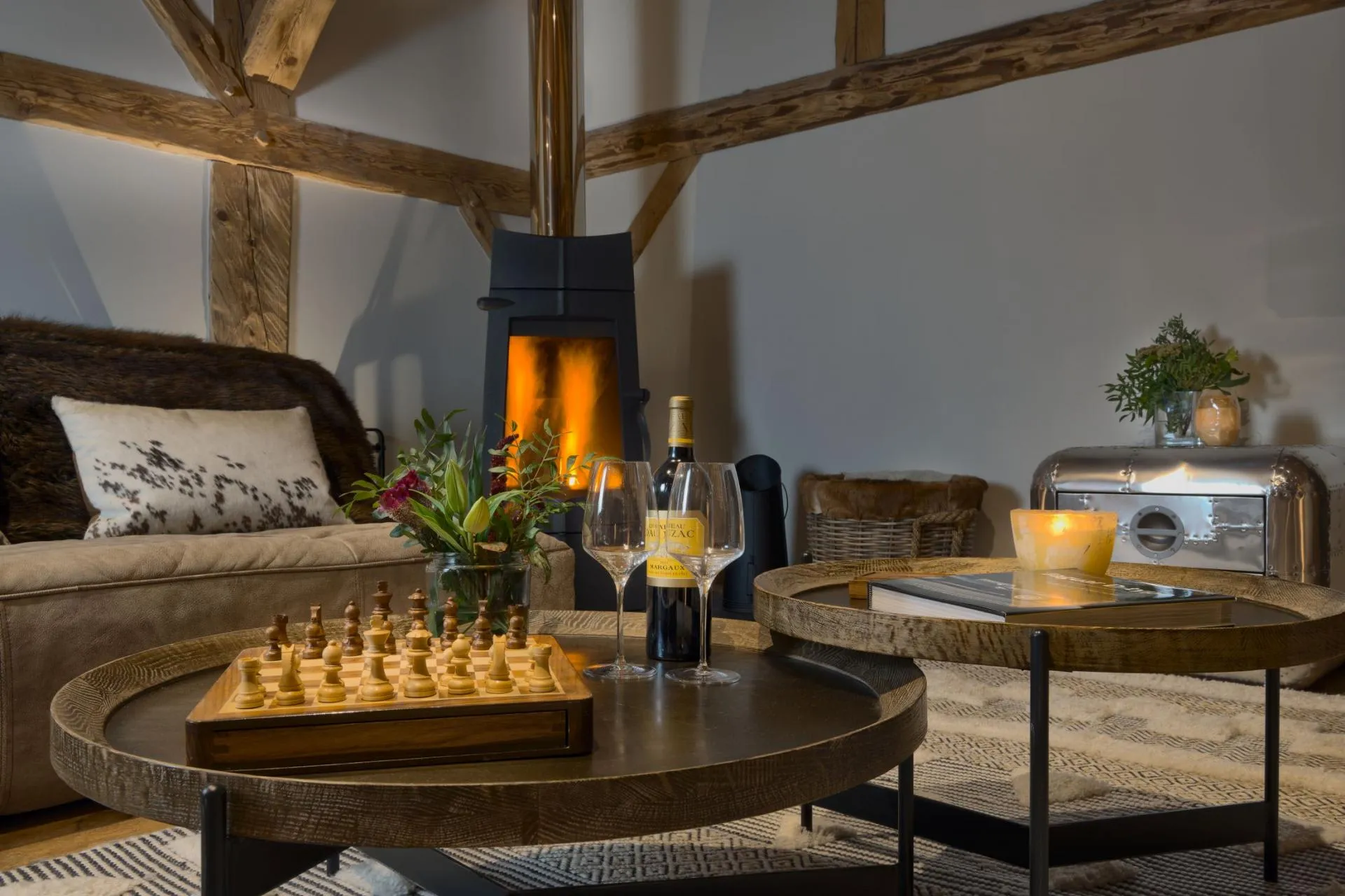 Seating area with wood-burning stove and original timber beams