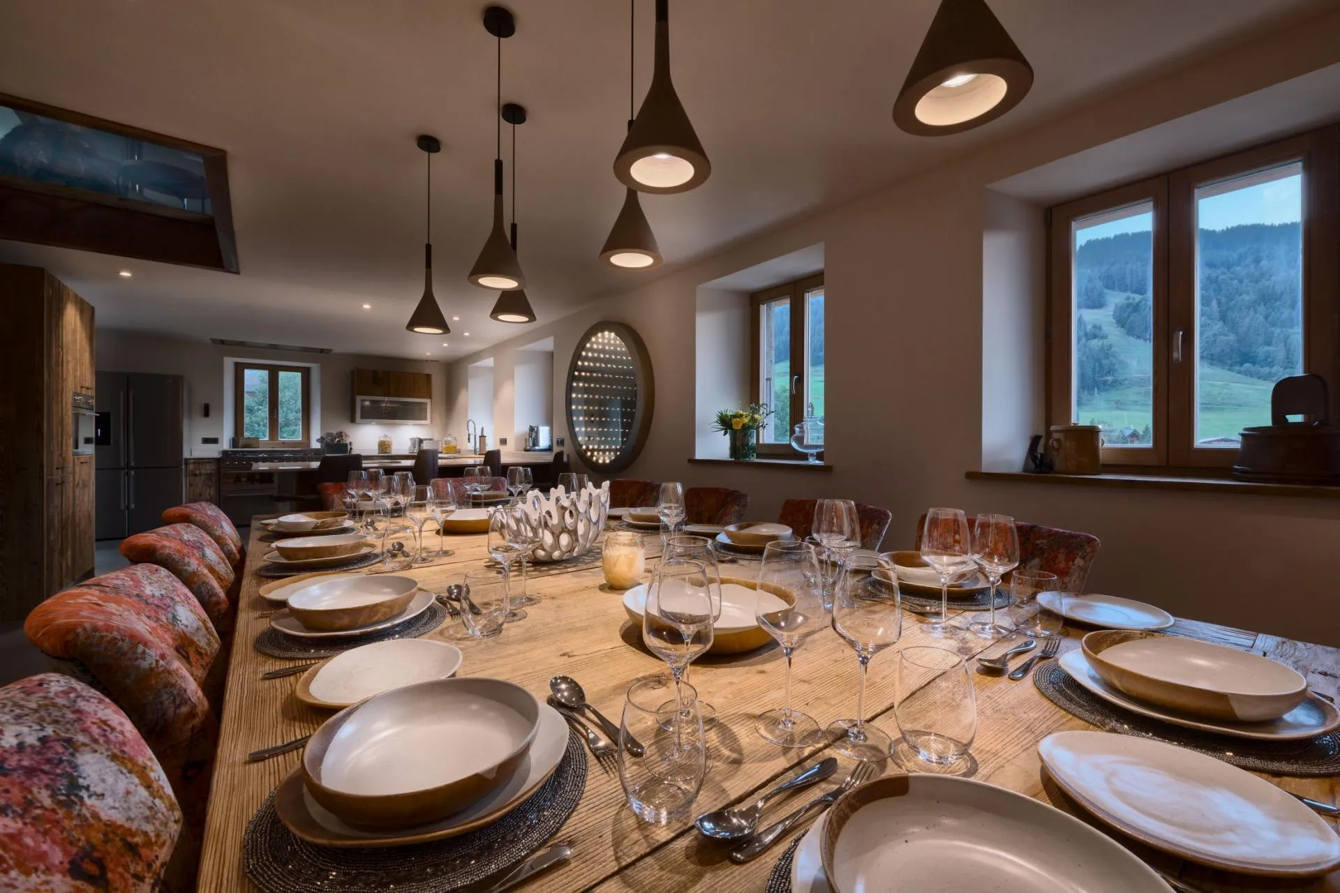 Dining area with seating for 12; mountain views and open kitchen access