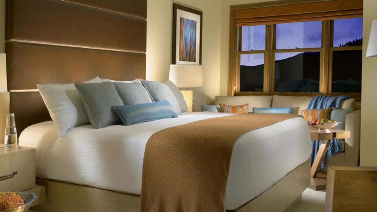 Primary bedroom with king bed and window-side reading nook