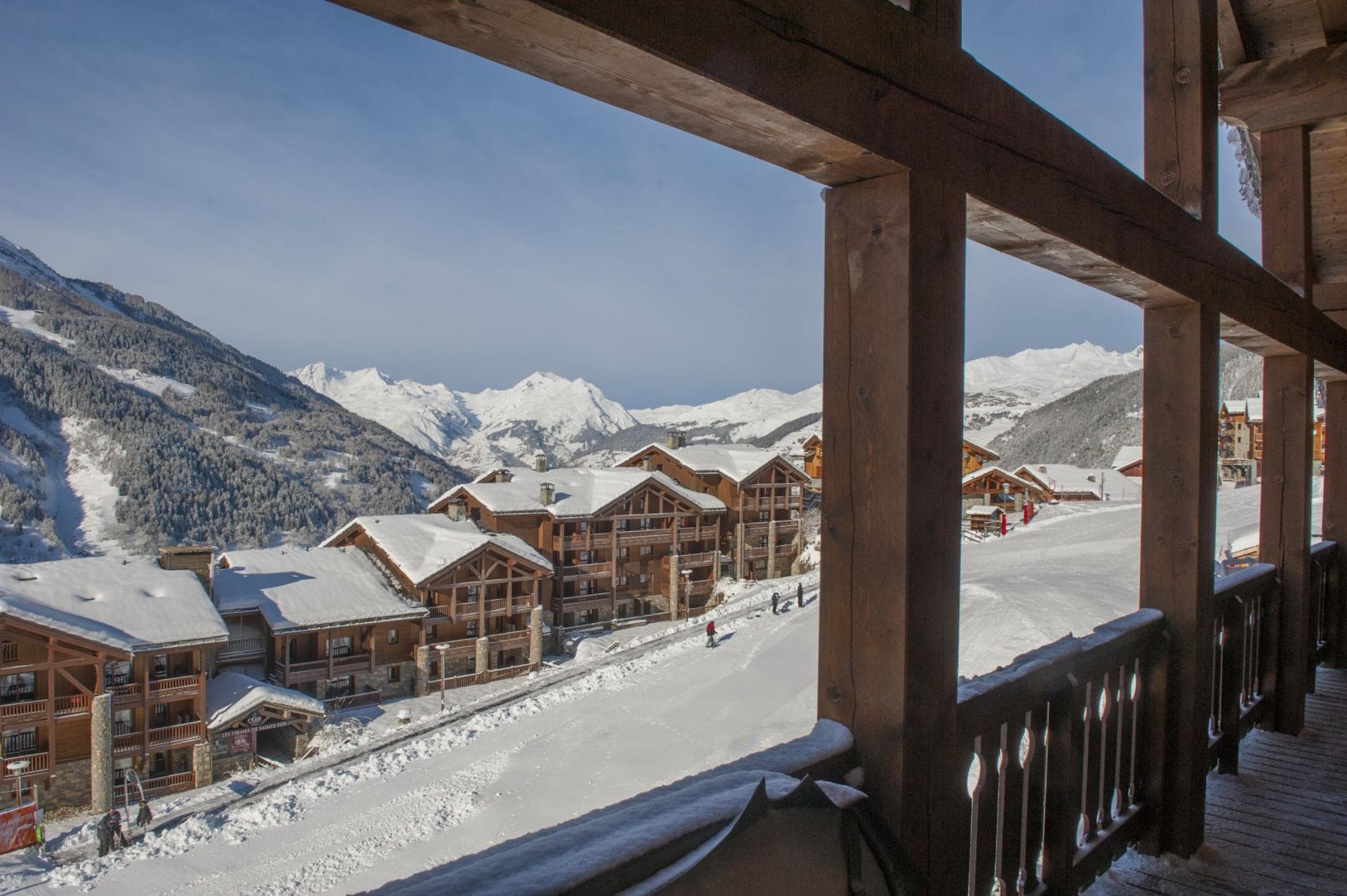Covered balcony with direct ski-in/ski-out access and mountain views