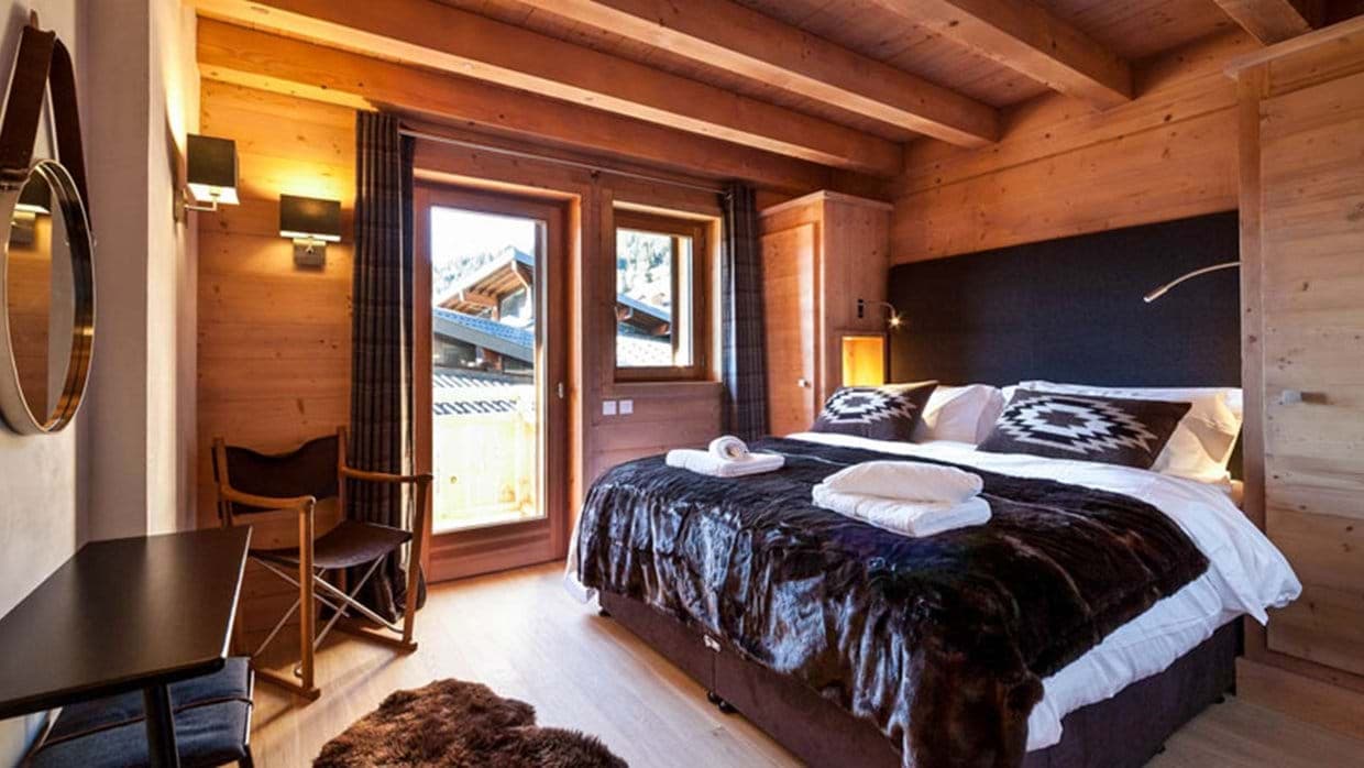 Bedroom with king bed and balcony access